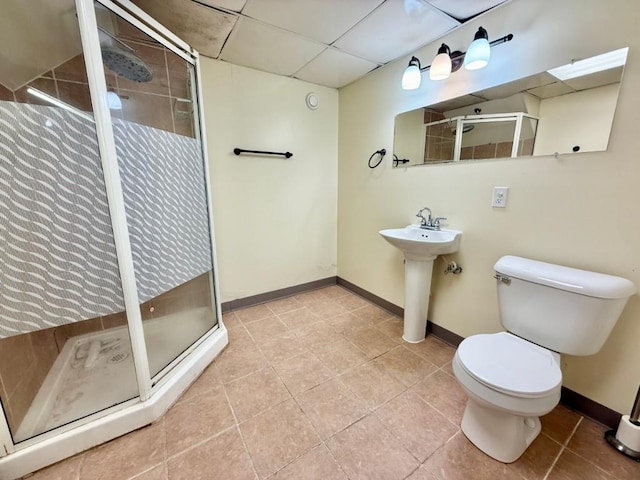 423 S 7th Ave, Iowa City, IA 52245 - full bathroom with tile patterned flooring, a stall shower, and a drop ceiling