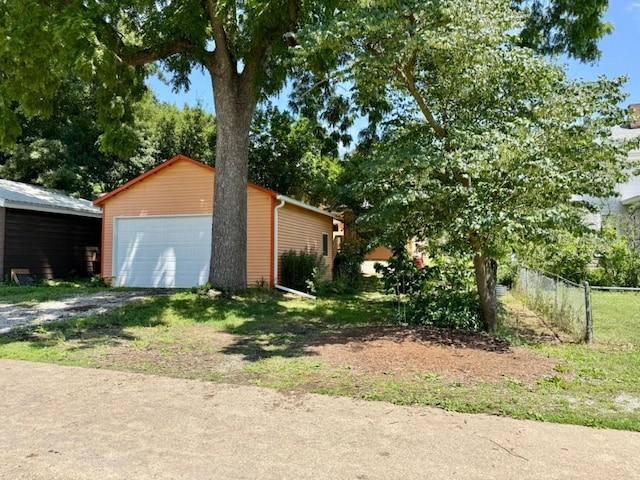 423 S 7th Ave, Iowa City, IA 52245 - view of property exterior with an outdoor structure and a detached garage