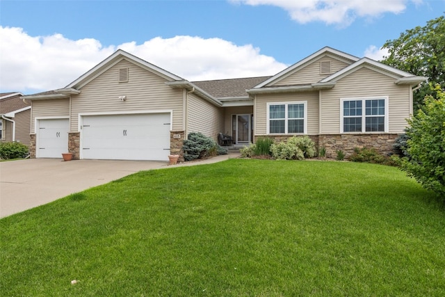 615 34th Ave, Marion, IA 52302 - view of front of house with stone siding, a garage, a front lawn, concrete driveway, and roof with shingles
