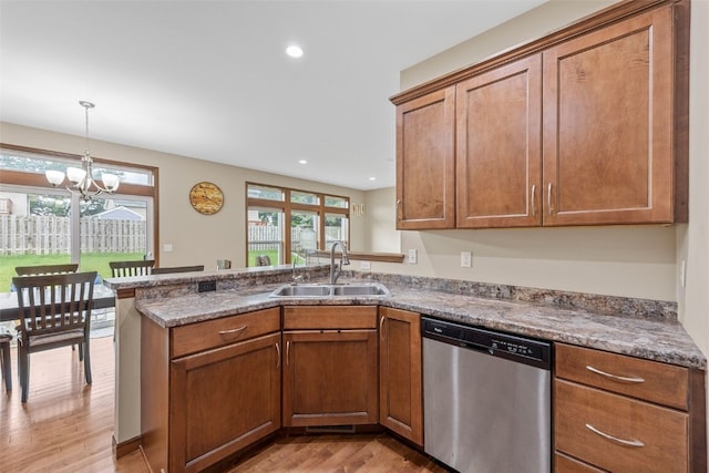 615 34th Ave, Marion, IA 52302 - kitchen featuring stainless steel dishwasher, light wood-style floors, a peninsula, brown cabinetry, and recessed lighting