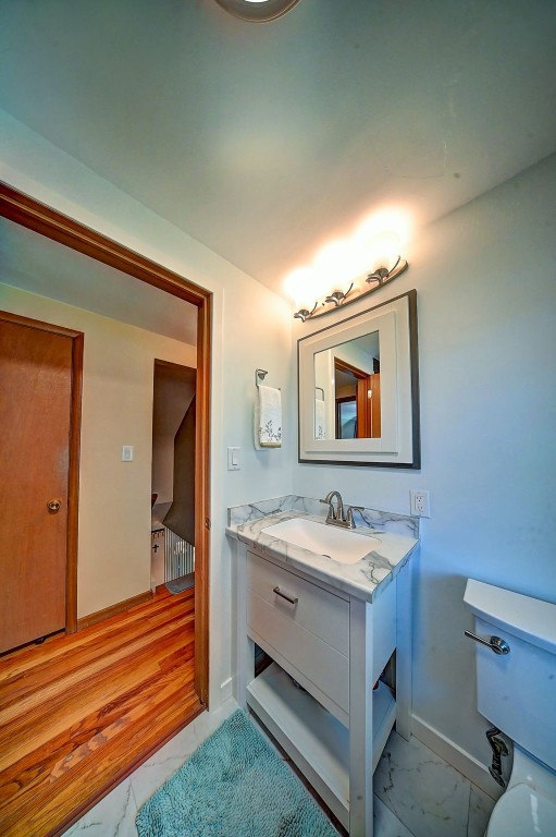 1175 28th St, Marion, IA 52302 - bathroom featuring marble finish floors and vanity