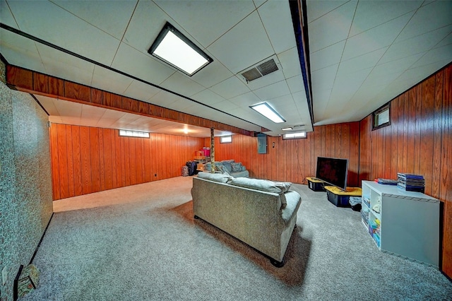 1175 28th St, Marion, IA 52302 - living area with wood walls and carpet floors
