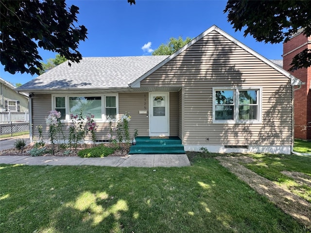 1175 28th St, Marion, IA 52302 - bungalow featuring a front lawn and a shingled roof