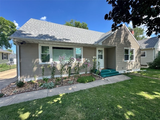 1175 28th St, Marion, IA 52302 - view of front of property with a front yard and roof with shingles