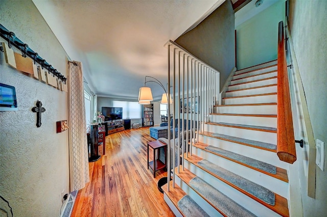 1175 28th St, Marion, IA 52302 - staircase with wood finished floors and a textured wall