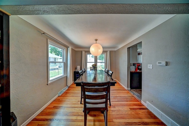 1175 28th St, Marion, IA 52302 - dining space featuring a textured wall and light wood-type flooring