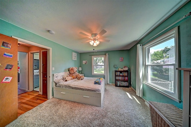 1175 28th St, Marion, IA 52302 - bedroom featuring light carpet and ceiling fan