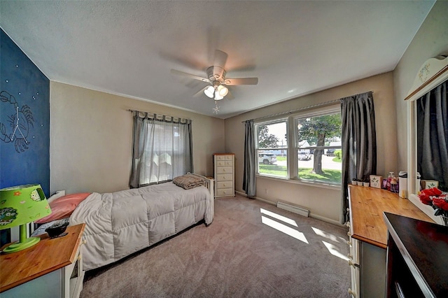 1175 28th St, Marion, IA 52302 - bedroom with a baseboard heating unit, light colored carpet, and a ceiling fan