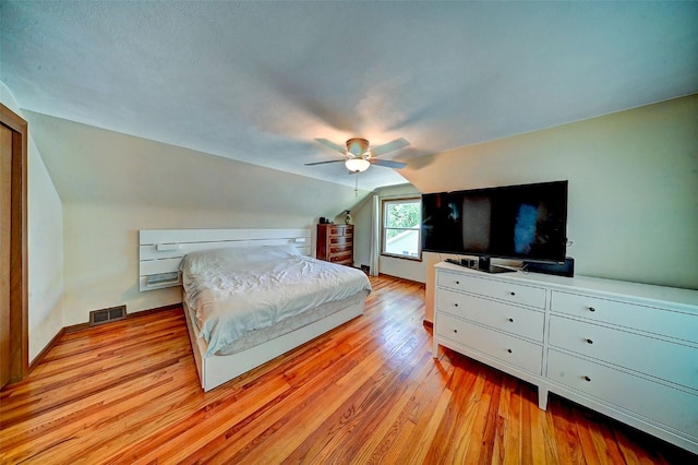 1175 28th St, Marion, IA 52302 - bedroom featuring light wood-style flooring, lofted ceiling, and a ceiling fan