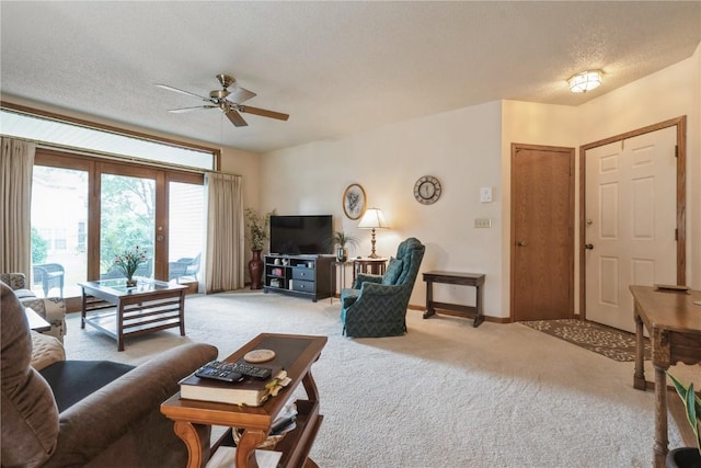 4555 Westchester Dr NE Unit B, Cedar Rapids, IA 52402 - living room with light carpet, ceiling fan, and a textured ceiling