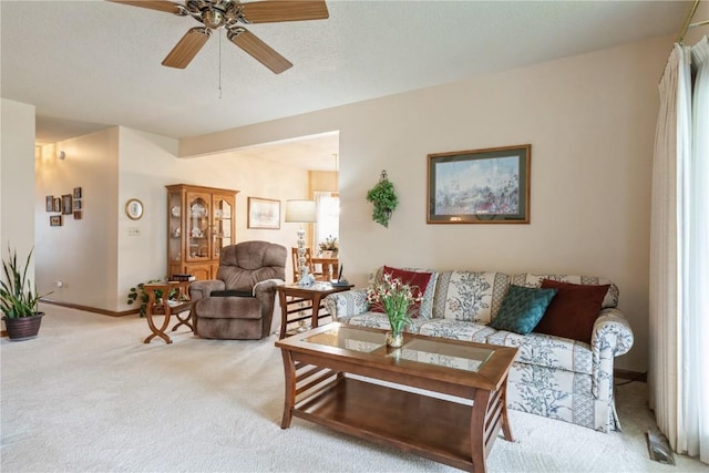 4555 Westchester Dr NE Unit B, Cedar Rapids, IA 52402 - living room with light colored carpet and a ceiling fan