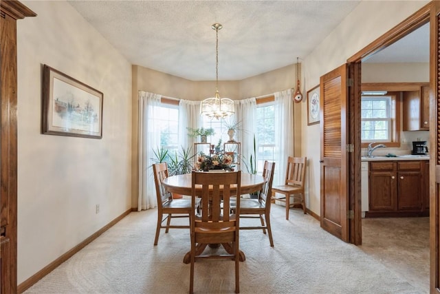 4555 Westchester Dr NE Unit B, Cedar Rapids, IA 52402 - dining area with light carpet and a chandelier