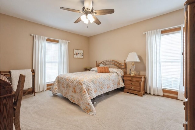 4555 Westchester Dr NE Unit B, Cedar Rapids, IA 52402 - bedroom featuring light colored carpet and ceiling fan