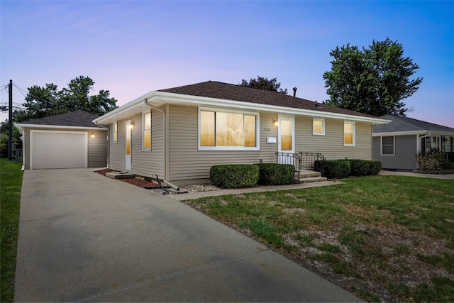 360 29th St NW, Cedar Rapids, IA 52405 - view of front of home featuring driveway, a lawn, and a garage