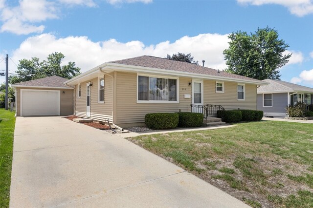 360 29th St NW, Cedar Rapids, IA 52405 - ranch-style home featuring concrete driveway, a garage, a front yard, and roof with shingles