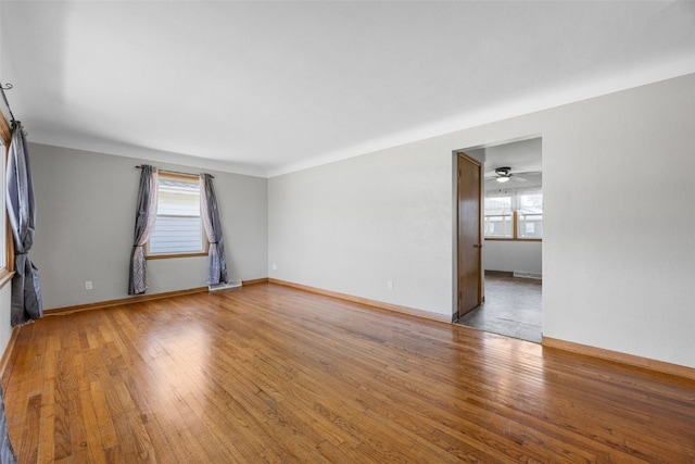 360 29th St NW, Cedar Rapids, IA 52405 - empty room with wood finished floors and a ceiling fan
