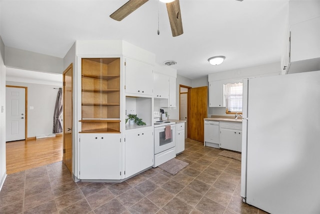 360 29th St NW, Cedar Rapids, IA 52405 - kitchen with white appliances, ceiling fan, white cabinets, light countertops, and open shelves