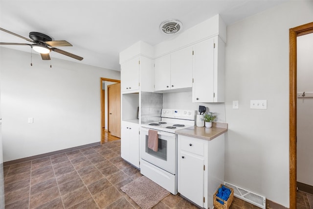 360 29th St NW, Cedar Rapids, IA 52405 - kitchen featuring white electric stove, ceiling fan, white cabinets, light countertops, and stone finish flooring
