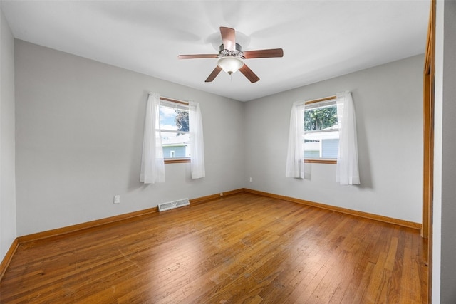 360 29th St NW, Cedar Rapids, IA 52405 - spare room with plenty of natural light, hardwood / wood-style flooring, and ceiling fan