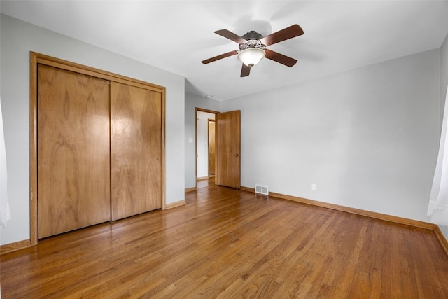 360 29th St NW, Cedar Rapids, IA 52405 - unfurnished bedroom with light wood-style flooring, a closet, and ceiling fan