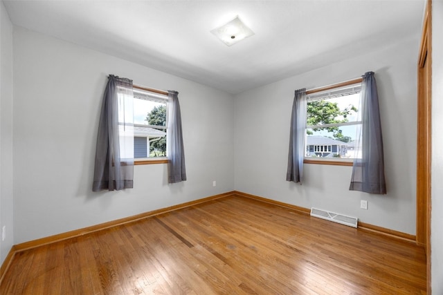360 29th St NW, Cedar Rapids, IA 52405 - spare room with healthy amount of natural light and light wood-style floors