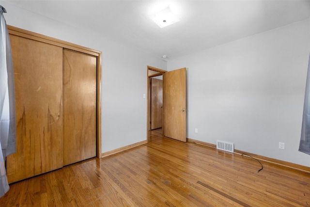 360 29th St NW, Cedar Rapids, IA 52405 - unfurnished bedroom featuring wood finished floors and a closet