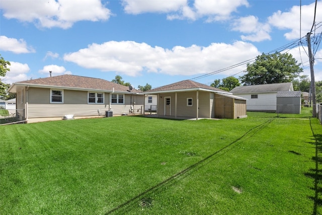 360 29th St NW, Cedar Rapids, IA 52405 - rear view of house with a storage unit and a fenced backyard