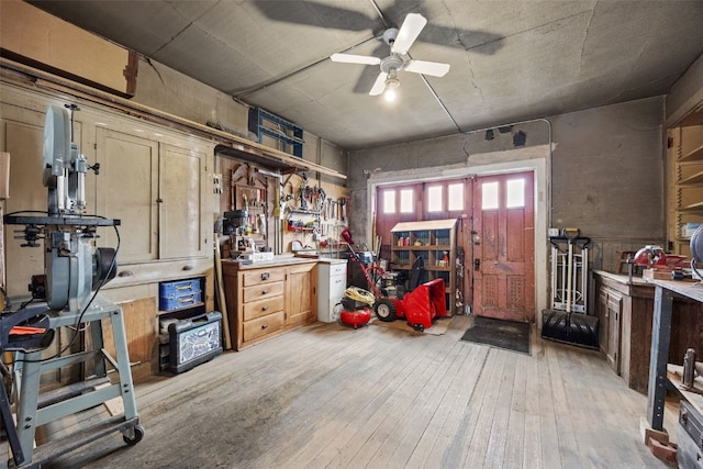 1860 E Ave NW, Cedar Rapids, IA 52405 - interior space with a workshop area, light wood-style floors, and ceiling fan