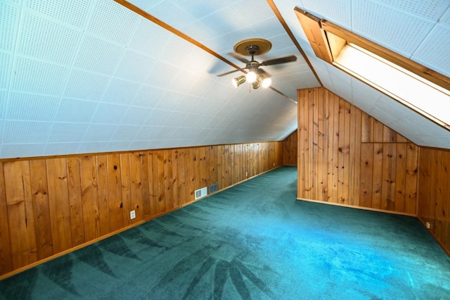 1135 Maplecrest Dr, Marion, IA 52302 - additional living space featuring carpet floors, ceiling fan, wood walls, and lofted ceiling