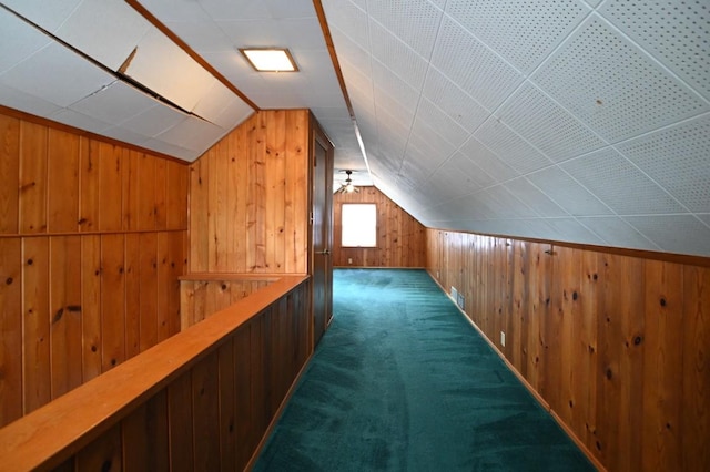 1135 Maplecrest Dr, Marion, IA 52302 - bonus room featuring wood walls, vaulted ceiling, and carpet flooring