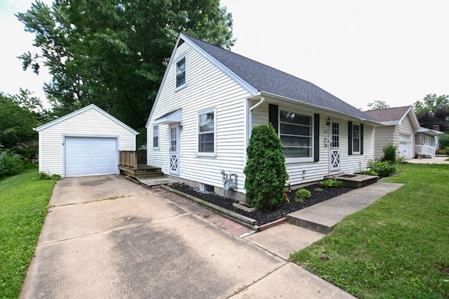 1135 Maplecrest Dr, Marion, IA 52302 - view of front facade featuring driveway, a detached garage, a front yard, an outdoor structure, and roof with shingles