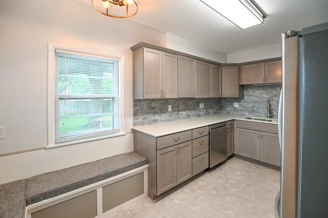 1135 Maplecrest Dr, Marion, IA 52302 - kitchen with stainless steel appliances, backsplash, light countertops, and gray cabinets