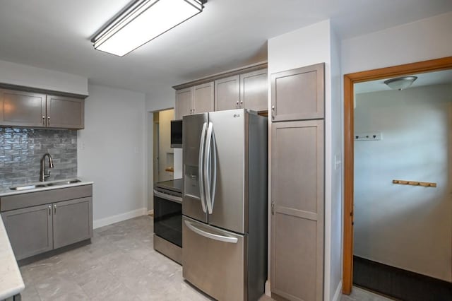 1135 Maplecrest Dr, Marion, IA 52302 - kitchen featuring appliances with stainless steel finishes, tasteful backsplash, and light countertops