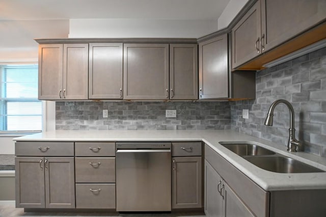 1135 Maplecrest Dr, Marion, IA 52302 - kitchen featuring stainless steel dishwasher, decorative backsplash, and light countertops