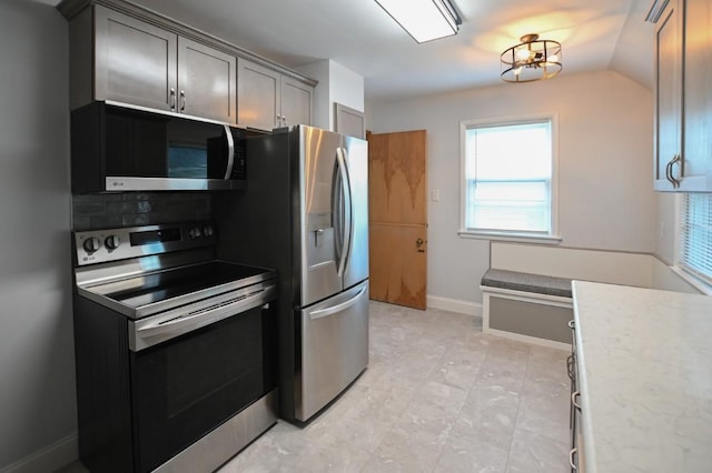 1135 Maplecrest Dr, Marion, IA 52302 - kitchen with stainless steel appliances, plenty of natural light, light countertops, and backsplash
