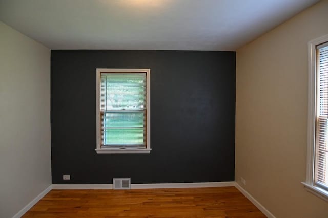 1135 Maplecrest Dr, Marion, IA 52302 - spare room featuring plenty of natural light and wood finished floors