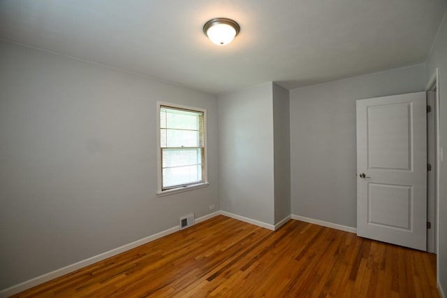 1135 Maplecrest Dr, Marion, IA 52302 - spare room with wood finished floors and baseboards