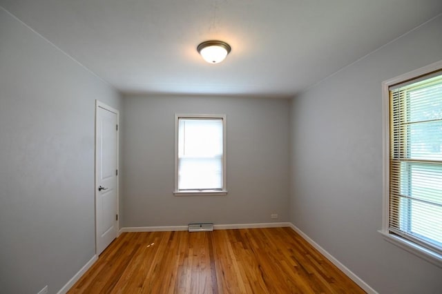 1135 Maplecrest Dr, Marion, IA 52302 - unfurnished room with wood finished floors and baseboards