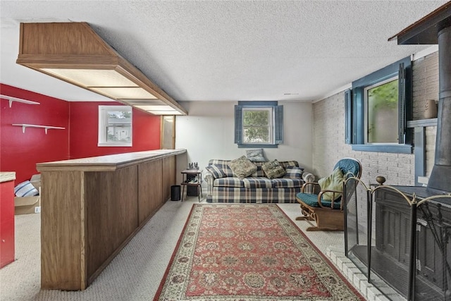 6613 Devonshire Dr NE, Cedar Rapids, IA 52402 - carpeted living room featuring a dry bar and a textured ceiling