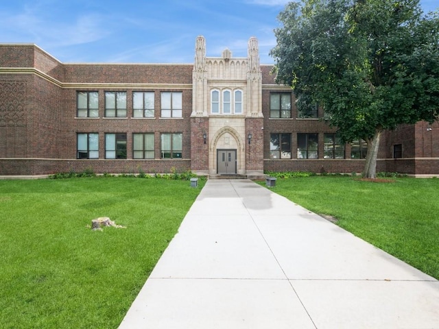 2408 J St SW, Cedar Rapids, IA 52404 - view of front facade with a front yard and brick siding