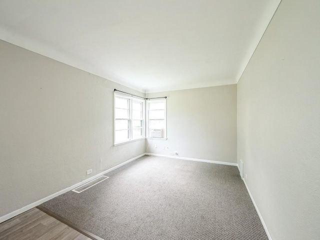 2408 J St SW, Cedar Rapids, IA 52404 - carpeted empty room featuring baseboards and cooling unit