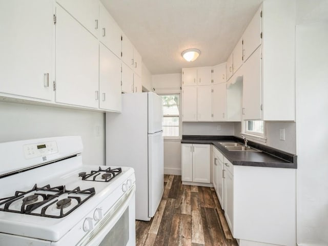 2408 J St SW, Cedar Rapids, IA 52404 - kitchen with white appliances, dark wood-style floors, and white cabinets