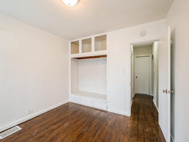 2408 J St SW, Cedar Rapids, IA 52404 - unfurnished bedroom featuring wood finished floors and baseboards