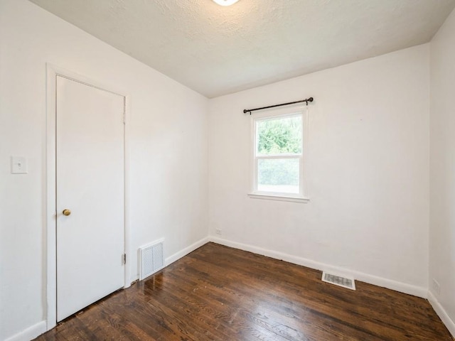 2408 J St SW, Cedar Rapids, IA 52404 - empty room with wood finished floors and baseboards