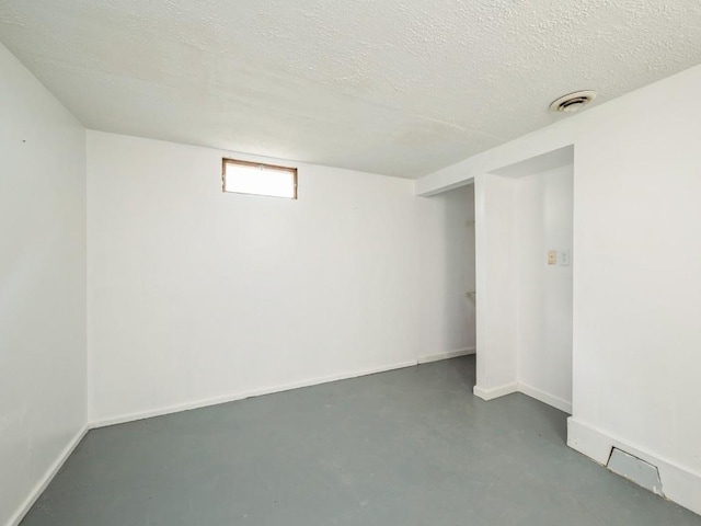 2408 J St SW, Cedar Rapids, IA 52404 - basement with a textured ceiling and baseboards