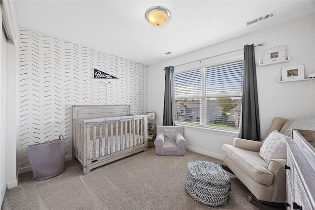 2455 Bridlewood Ct, Marion, IA 52302 - carpeted bedroom featuring baseboards and a crib
