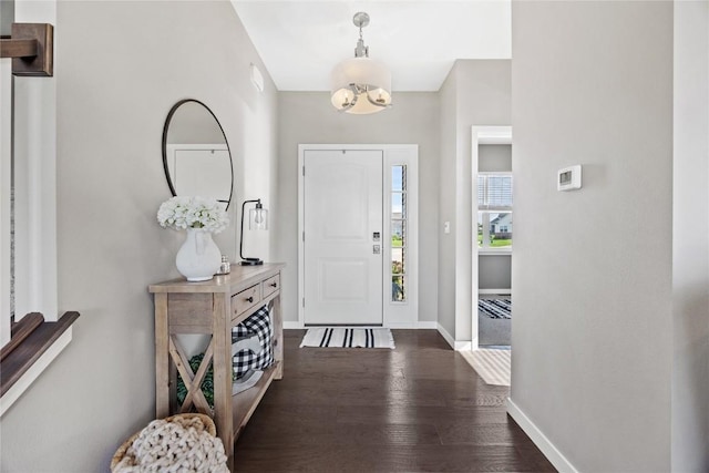 2455 Bridlewood Ct, Marion, IA 52302 - entryway featuring dark wood-style floors and a chandelier