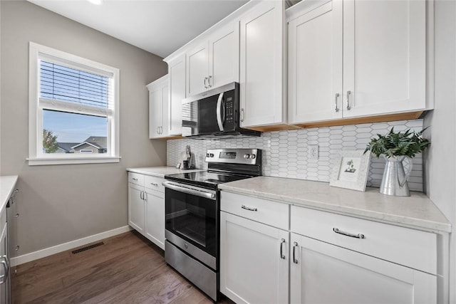 2455 Bridlewood Ct, Marion, IA 52302 - kitchen featuring appliances with stainless steel finishes, tasteful backsplash, and white cabinetry