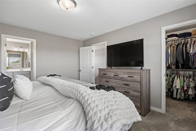2455 Bridlewood Ct, Marion, IA 52302 - bedroom with carpet floors, a walk in closet, and connected bathroom