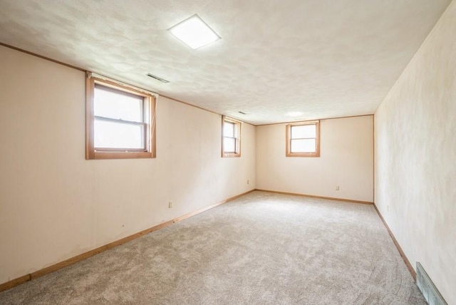 2029 Knollshire Rd NE, Cedar Rapids, IA 52402 - below grade area with light carpet and baseboards